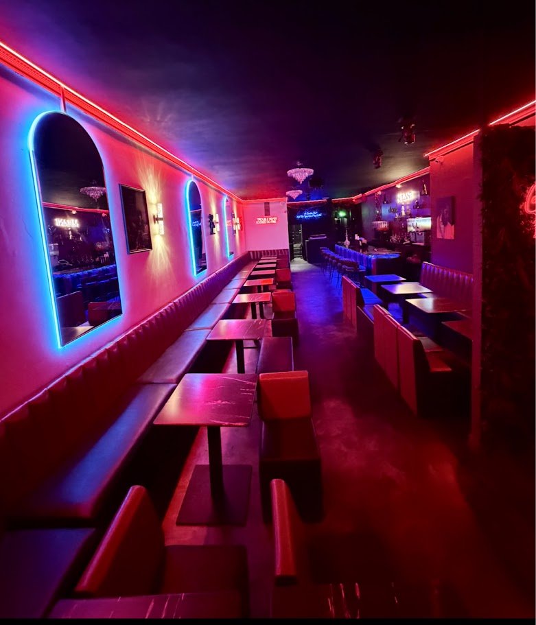 Elegant restaurant interior with vibrant lighting.