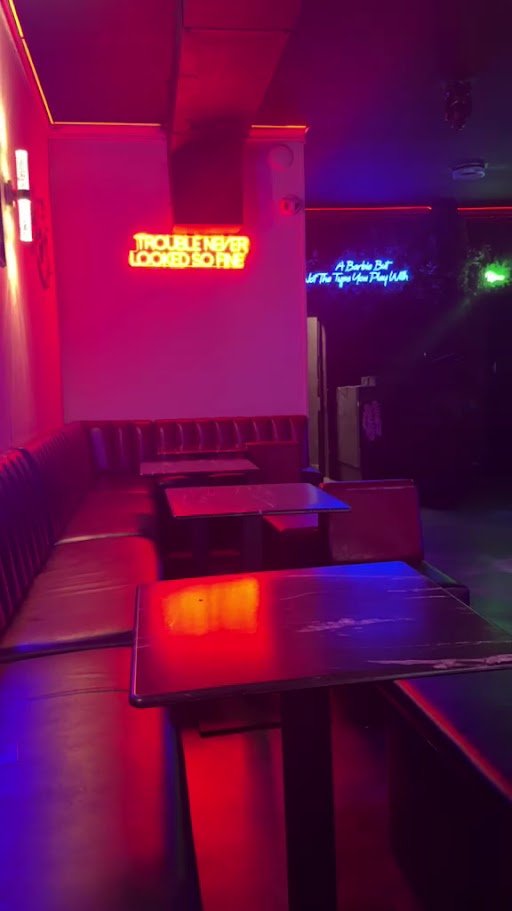 Artful interior with glowing nightlife lighting.